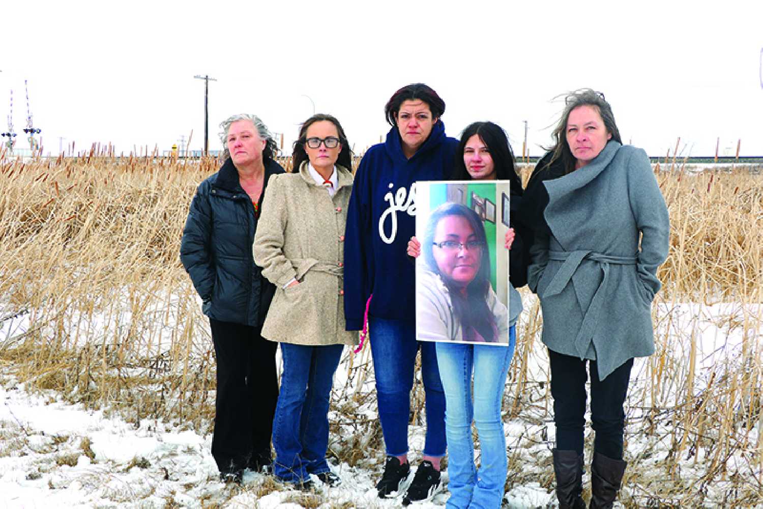 Karen Ireland�s family standing in front of  the spot where she was found deceased in 2022, just east and slightly north of the South East Integrated Care Centre. From left are Karen�s first cousin Tracy Stevens, Karen�s sister Ruth Desjarlais, Karen�s daughter-in-law Jacklyn Ireland, Karen�s granddaughter Aynzley Ireland, and Karen�s sister Kerri-Ann Ireland